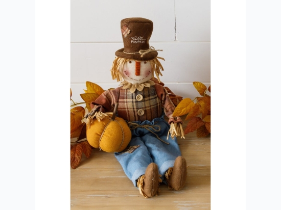 Scarecrow Sitter Holding Pumpkin